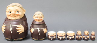 A Goebel biscuit barrel in the form of a monk PX106 7", 3 ditto egg cups E95/A, a pair of ditto salt and peppers and a large biscuit barrel and cover 10", a similar figure of a monk 1 1/2" 