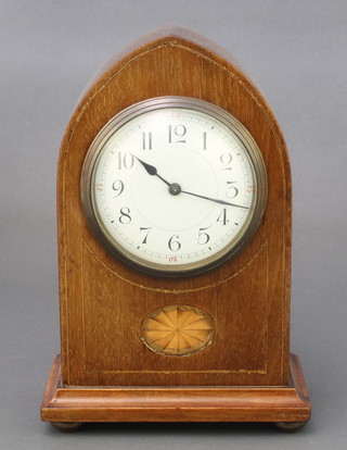 An Edwardian bedroom timepiece with enamelled dial and Arabic numerals, contained in an inlaid mahogany lancet case 