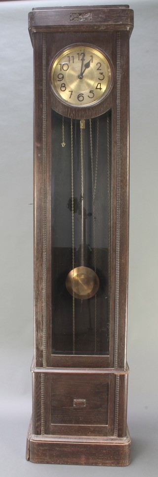 A 1930's 8 day striking longcase clock with 12" gilt dial and Arabic numerals contained in a carved oak case 82 1/2"h 