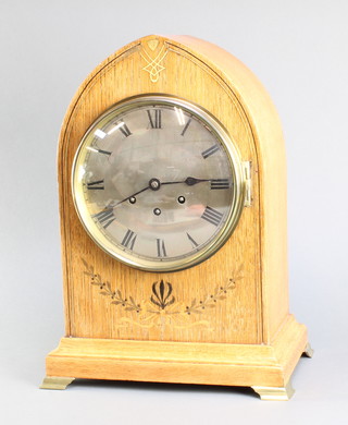Gustav Becker, a chiming bracket clock with 8" silvered dial, contained in an inlaid oak lancet case, striking on a gong, the back plate signed Gustav Becker P21 