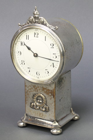 An Edwardian 8 day bedroom timepiece with enamelled dial and Arabic numerals, contained in a planished silver plated case 