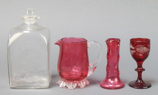 A Victorian cranberry jug 4", a rustic ditto vase in the form of a tree trunk 4", a ruby liqueur 4" and a 19th Century square decanter and stopper 6"
