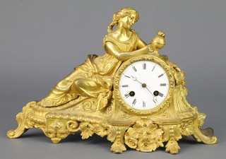 James and Walter Marshall, a 19th Century French 8 day mantel clock with enamelled dial and Arabic numerals contained in a gilt ormolu case surmounted by a figure of a reclining lady with globe 