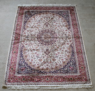 A contemporary Keshan style white ground Belgian cotton rug with central medallion 109 x 78 1/2" 
