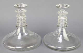 A pair of ships decanters with four ring neck collars 10" 