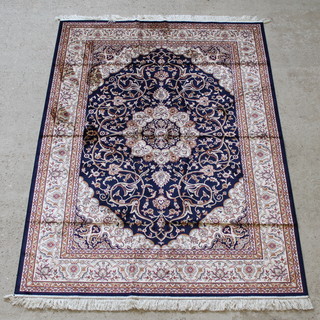 A contemporary blue ground Belgian cotton Keshan style rug with central medallion 89" x 64" 
