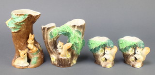 4 items of Hornsea Fauna pottery comprising a tree trunk vase with rabbit and deer 7", a do. with squirrel 6" and a pair of vases with squirrels 3 3/4" 