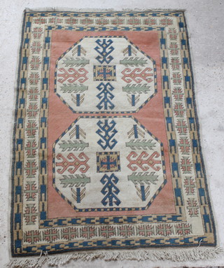 A Caucasian style rug with 2 octagons within multi row borders 70" x 47" 