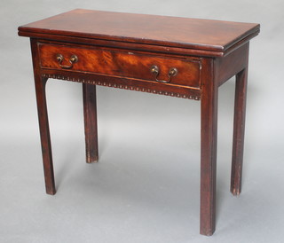 A Georgian rectangular mahogany tea table fitted a drawer with carved dentil apron, raised on square tapered supports 28"h x 33" x 16" 