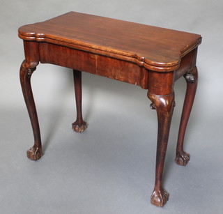 A George III mahogany tea table fitted a drawer and raised on cabriole ball and claw supports 28"h x 32 1/2" x 17"w 