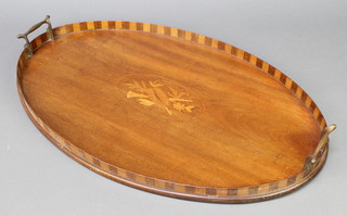 An Edwardian oval inlaid mahogany twin handled tea tray, the centre inlaid musical trophies 1" x 22"w x 14"d 