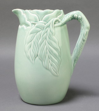 A Clarice Cliff green glazed moulded jug decorated with leaves 9 1/2" 