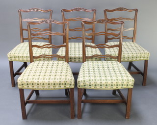 A set of 5 mahogany London ladder back chairs with overstuffed seats, raised on square supports with H framed stretchers