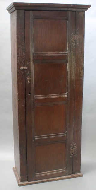 An oak hall wardrobe constructed from 18th Century oak enclosed by a panelled door 75"h x 31 1/2"w x 16"d 