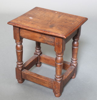 A rectangular oak joined stool, raised on turned and block supports with box stretcher 16"h x 14 1/2"w x 12"d 