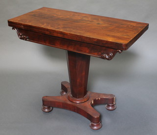 A William IV rectangular rosewood card table raised on a chamfered column with triform base and bun feet 30"h x 36"w x 18"d 