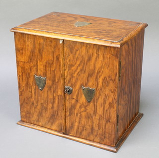 An Edwardian oak smokers cabinet the interior fitted a drawer enclosed by panelled doors 12" x 12" x 9" 