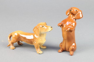 A Beswick figure of a seated Dachshund 4", a Continental ditto 4" 