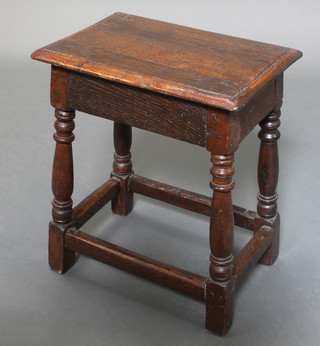 An 18th Century oak joined stool raised on turned and block supports with box stretcher 21"h x 17 1/2"h x 12"d 