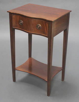 A Georgian style mahogany side table of serpentine outline, fitted a frieze drawer and raised on square supports with undertier 26 1/2"h x  60 1/2"w x 12 1/2"d  