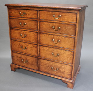 A good quality oak chest of 10 short drawers with brass swan neck drop handles, raised on bracket feet 48"h x 48"w x 22"d 