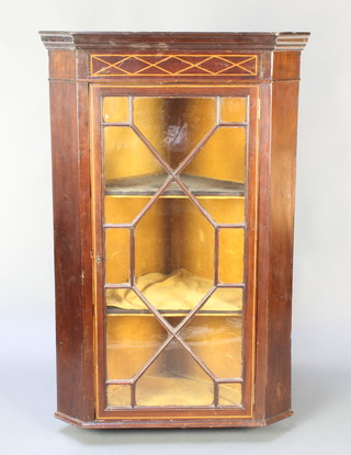 A 19th Century inlaid mahogany hanging corner cabinet with moulded cornice enclosed by astragal glazed panelled doors 40 1/2"h x 27"w x 17"d 