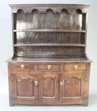 An 18th Century oak dresser, the raised back with cornice fitted 2 shelves, the base fitted 3 long drawers above a double cupboard , enclosed by arched panelled doors with iron H frame hinges  72.5"h x x 60"w x 20"d 