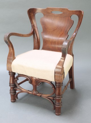 A Continental Art Nouveau mahogany slat back carver chair, raised on turned supports with H framed stretcher 
