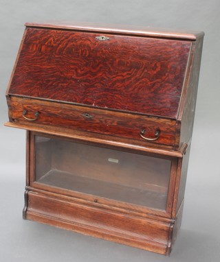 An oak 2 section Globe Wernicke bureau bookcase, the upper section with fall front above 1 long drawer, the base fitted a glazed cabinet labelled Globe Wernicke 44"h x 34"w x 19"d 
