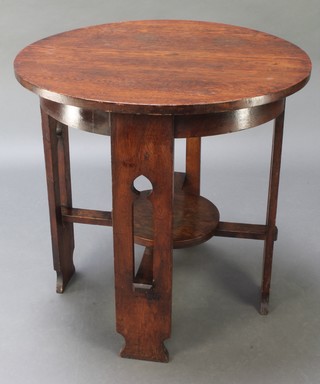 A circular Art Nouveau table raised on 4 pierced panelled supports with circular undertier 28"h x 29" diam. 