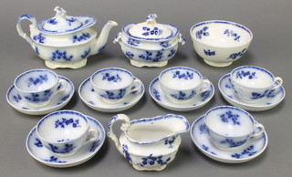 A 19th Century English miniature blue and white teaset comprising teapot, lidded sugar bowl, cream jug, slop bowl, 6 cups and 6 saucers decorated with blue floral sprays