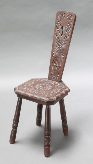 A carved mahogany spinning chair