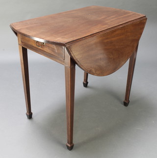 A 19th Century oval mahogany Pembroke table raised on square tapering supports ending in spade feet 28"h x 34"w x 18" when closed x 39 1/2" when open 