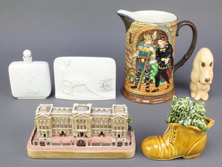 A Beswick jug decorated Hamlet, 1146, 7 1/2", a Lladro Collectors Society plaque decorated a seated gentleman 4", a Royal Copenhagen flask decorated a kneeling lady and goose 4015 4 1/2", a Sylvac figure of a seated dog 2950 5", a Sylvac model of a boot with kittens 4977 4 1/2" and a Lilliput Lane model of Buckingham Palace for the Queen and Prince Philip's Diamond anniversary 7 1/2" 