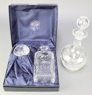 A Stuart Crystal spirit decanter and stopper 8 1/2" (chip to rim) and a cut glass mallet shaped decanter and stopper 11" 
