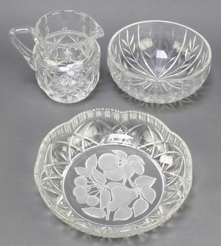A cut glass jug 6", a etched and impressed glass bowl 10", circular cut glass fruit bowl 8" (chip to rim)