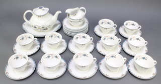 A 42 piece Royal Doulton Old Colony pattern tea service comprising 2 twin handled plates, 12 tea plates (2 cracked), cream jug, 2 sugar bowls, 12 cups and 12 saucers 