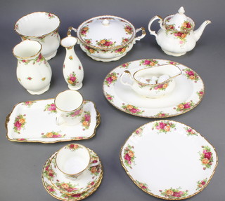 A Royal Albert Old Country Roses tea, coffee and dinner service comprising 12 tea cups, 13 saucers, 8 coffee cups, 8 saucers, 14 small plates, 8 medium plates, 8 dinner plates, 8 small bowls, 9 medium bowls, 8 large bowls, 1 teapot, 1 breakfast teapot, 2 milk jugs, 2 sugar bowls, sauce boat and stand, 2 rectangular dishes, 3 jardinieres, 2 vases, 3 oval bowls, 3 platters, 3 dishes, a tureen and lid, cake stand base and minor china