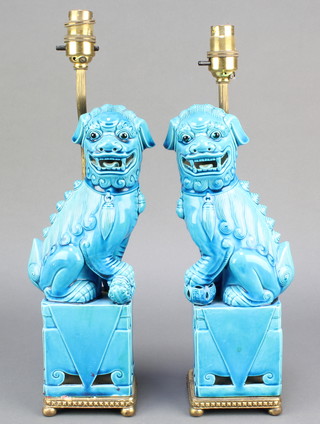 A pair of turquoise glazed figures of shi shi standing on seats converted to electricity 16" 