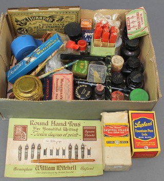 A quantity of various ink bottles, sealing wax and other writing related equipment 
