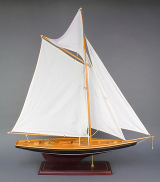A wooden model of a J class yacht 38"h x 34"w x 6"d 