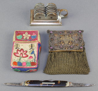 A 19th Century chain mail evening purse the hinged lid incorporating a sovereign case and compact, a folding pocket knife, an embroidered cigarette case 3" x 2" and a patented table knife sharpener 