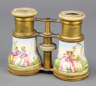 A pair of 19th Century French gilt metal and enamelled opera glasses, decorated romantic scenes