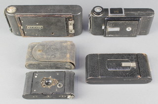 A Kishaw 8-20 King Penguin folding camera, a Coronet folding camera, a Kodak 25 BT50 ball bearing shutter folding camera, a 1A pocket Kodak Junior folding camera (bellows stiff) 

