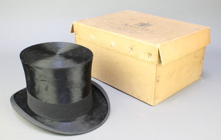 A gentleman's black silk top hat by Scots dated 1937, approx. size 7, complete with cardboard case