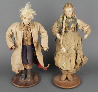 A pair of 19th/20th Century Northern European costume dolls 12" 
