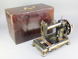 An E White Peerless sewing machine retailed by E G Benford 61 Castle Square Brighton complete with wooden case, some paint loss 