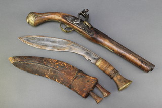 An 18th Century Continental flintlock pistol with 10 1/2" barrel together with a Kukri with 11 1/2" blade complete with sheath and 2 skinning knives 