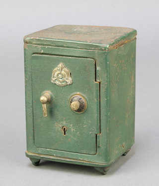 A tin plate money box in the form of a green painted safe complete with key and combination of 3, 4" x 3" x 2 1/2" 