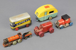 A CKO tin plate model locomotive footman, locomotive and tender 4 1/2" (some dents to tender and no key) a Continental clockwork tin plate lorry 2", ditto Mimic toy tractor 3" (no key), a Continental tin plate model of an express train 3", a KC tin plate caravan 3 1/2"  